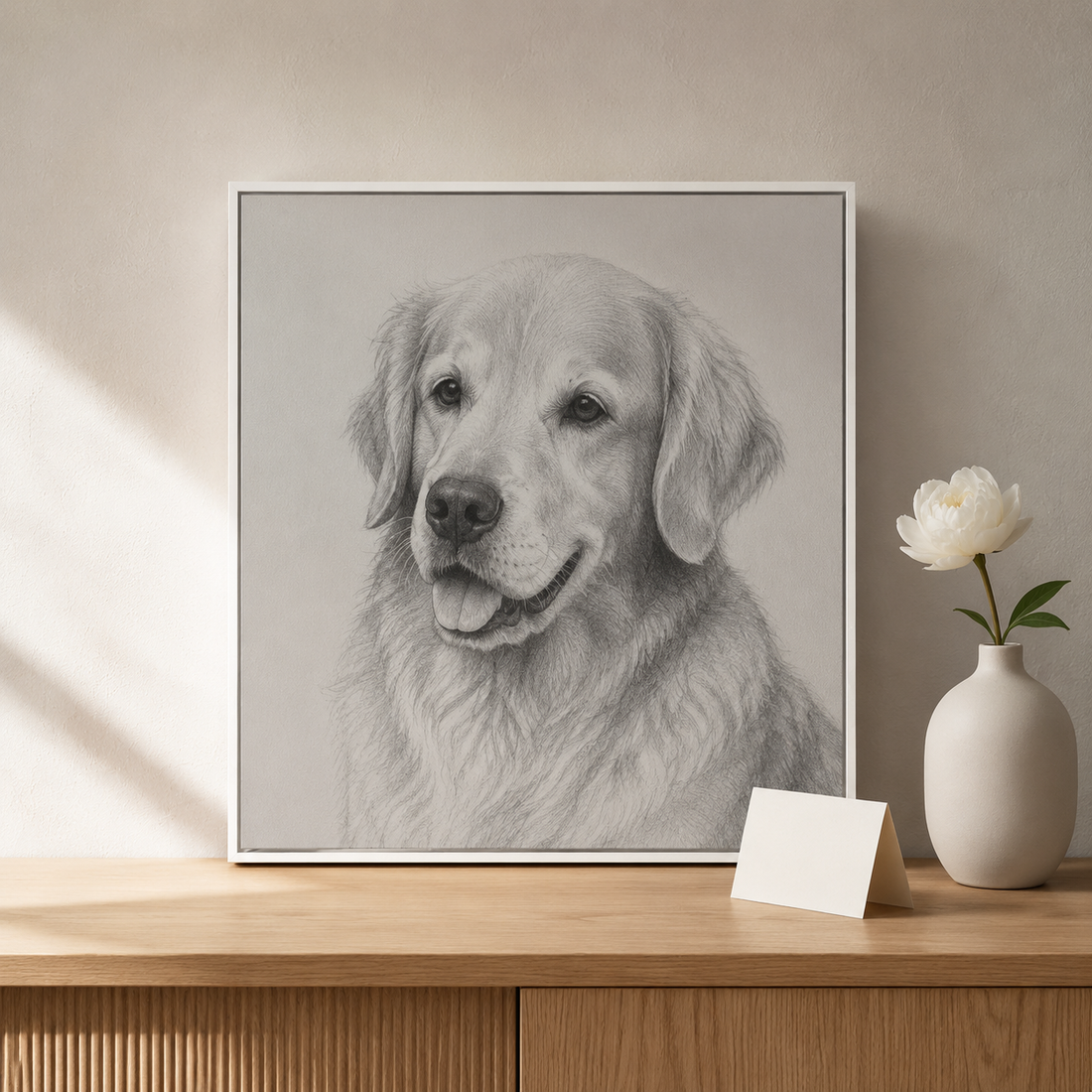 Illustrative example of a white-framed Graphite Pencil golden retriever portrait beside a blank card and flower